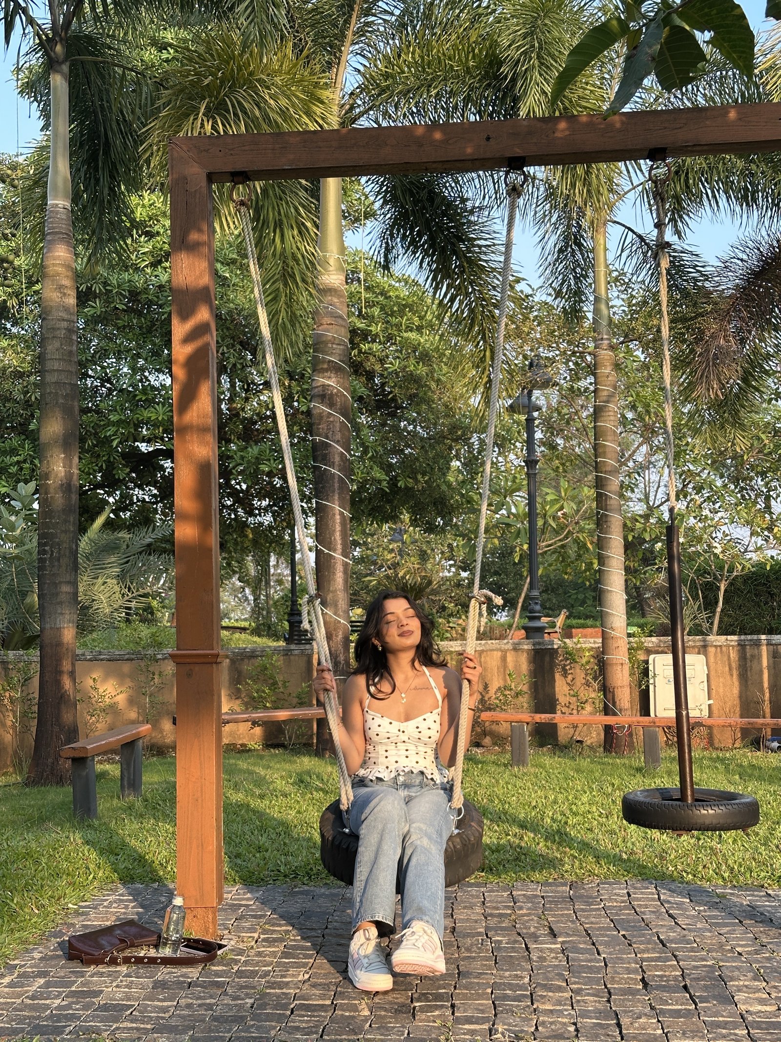 Riya Rakesh outdoor garden swing portrait